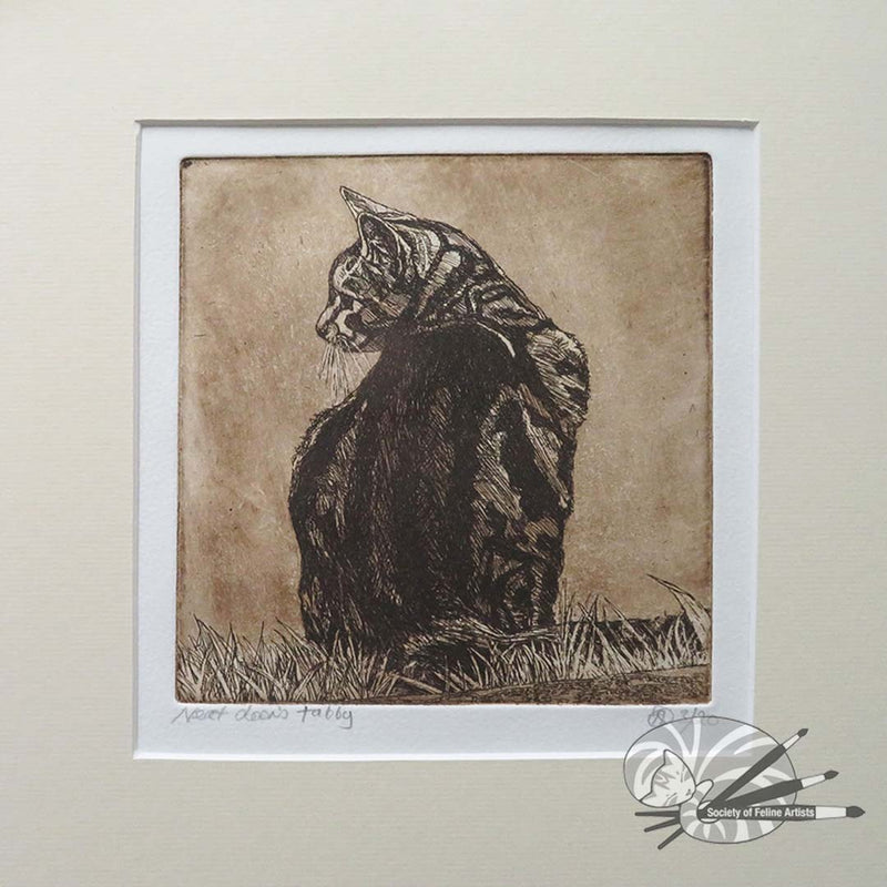 An mounted etching of a cat sitting on grass with a textured background by Avril Sleeman