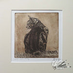 Load image into Gallery viewer, An mounted etching of a cat sitting on grass with a textured background by Avril Sleeman
